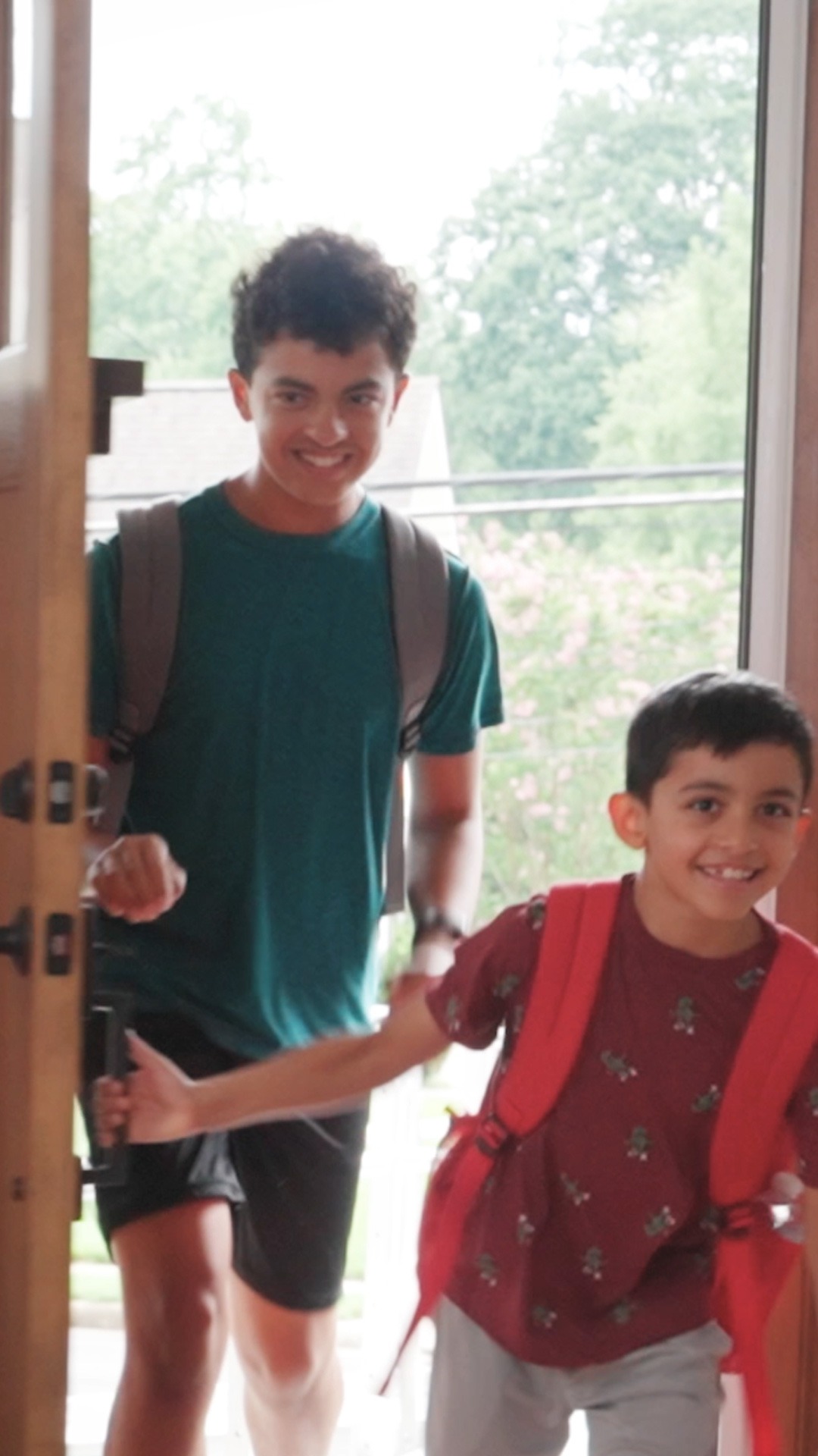 Greeting kids after school is more fun when you  can grill them about their day. Even with ALS, Allistair gets the details.