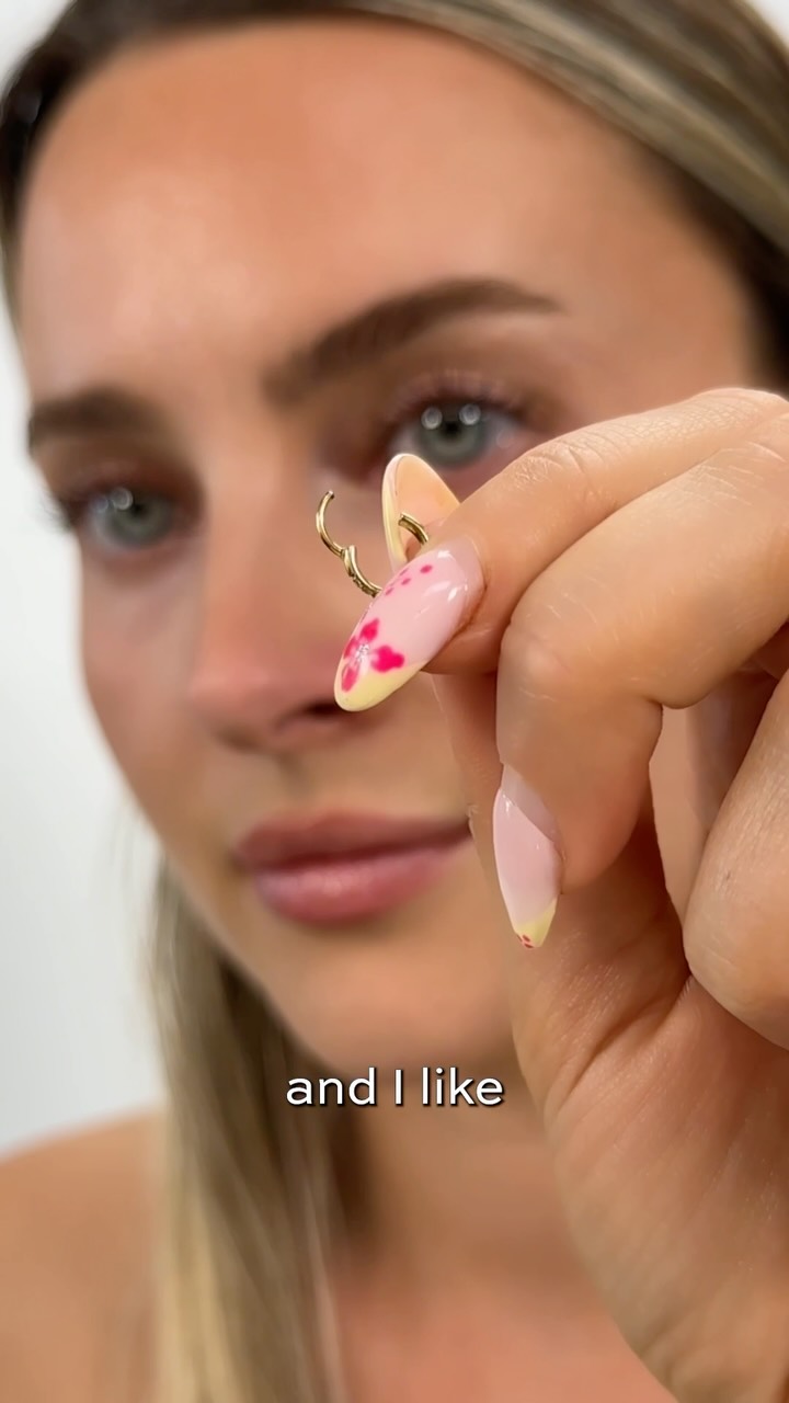 ✨ How I Change My Nose Hoop ✨

I've been wearing our gorgeous Angel Cartilage Hoop in my nose for a long time now - and it's still as sparkly as the first day I put it in 🤩

I often get asked how it works, so here's a quick tutorial and some top tips 🫶

✨ Use a labret insertion tool to flip open the loop because if you have longer nails like me - this can be the hardest bit!

✨ Insert your hoop from the inside out, this way the loop clicks together on the outside which makes it much easier to remove again.

✨ A nose piercing is usually not changed often and left in for extended periods of time, so you'll want to use jewellery that is waterproof and tarnish-free such as Titanium. Don't use brass or alloy metals as these corrode and will turn green - yuck!

✨ Make sure your hoop is the correct size - my piercing hole has shrunk, so I wear the 20g which is much thinner than standard sizes such as 16g.

I hope that helps and let me know in the comments whether you prefer to wear a hoop or a stud? 👃

Tasha x
.
.
.
#crystalheavenlondon #nosepiercing #piercinghack #piercingtips #piercingideas #nostrilpiercing #titaniumjewelry