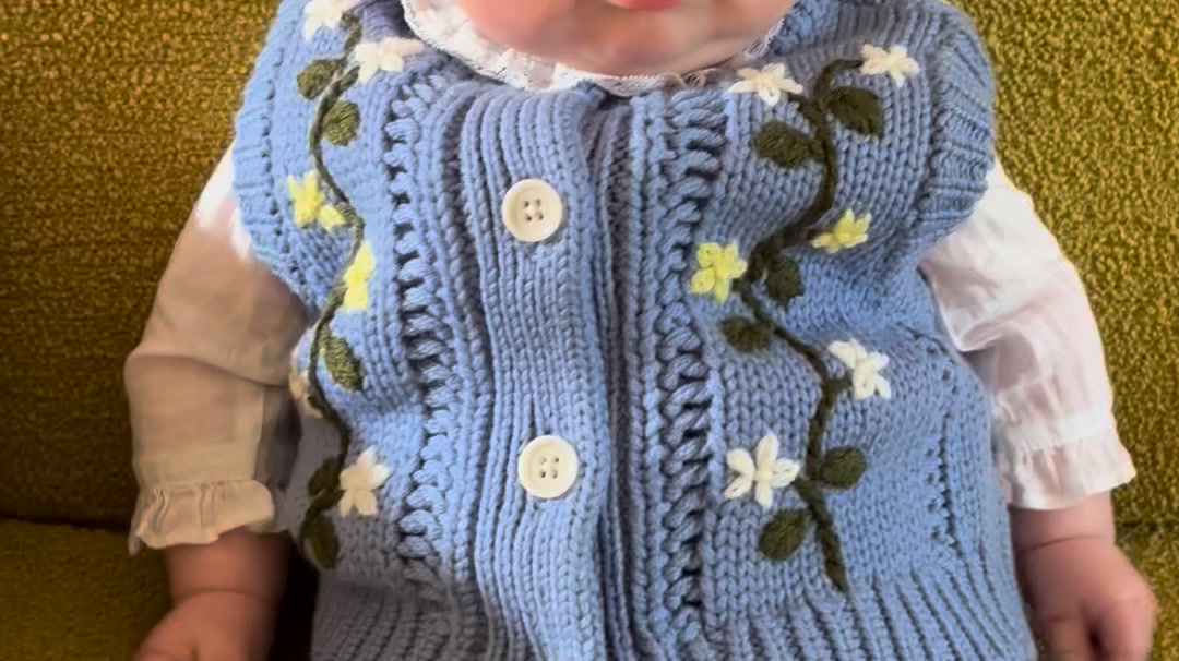 Merino wool and hand-embroidered.